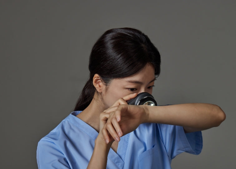 Lady looking at skin through ids-1100 dermatoscope