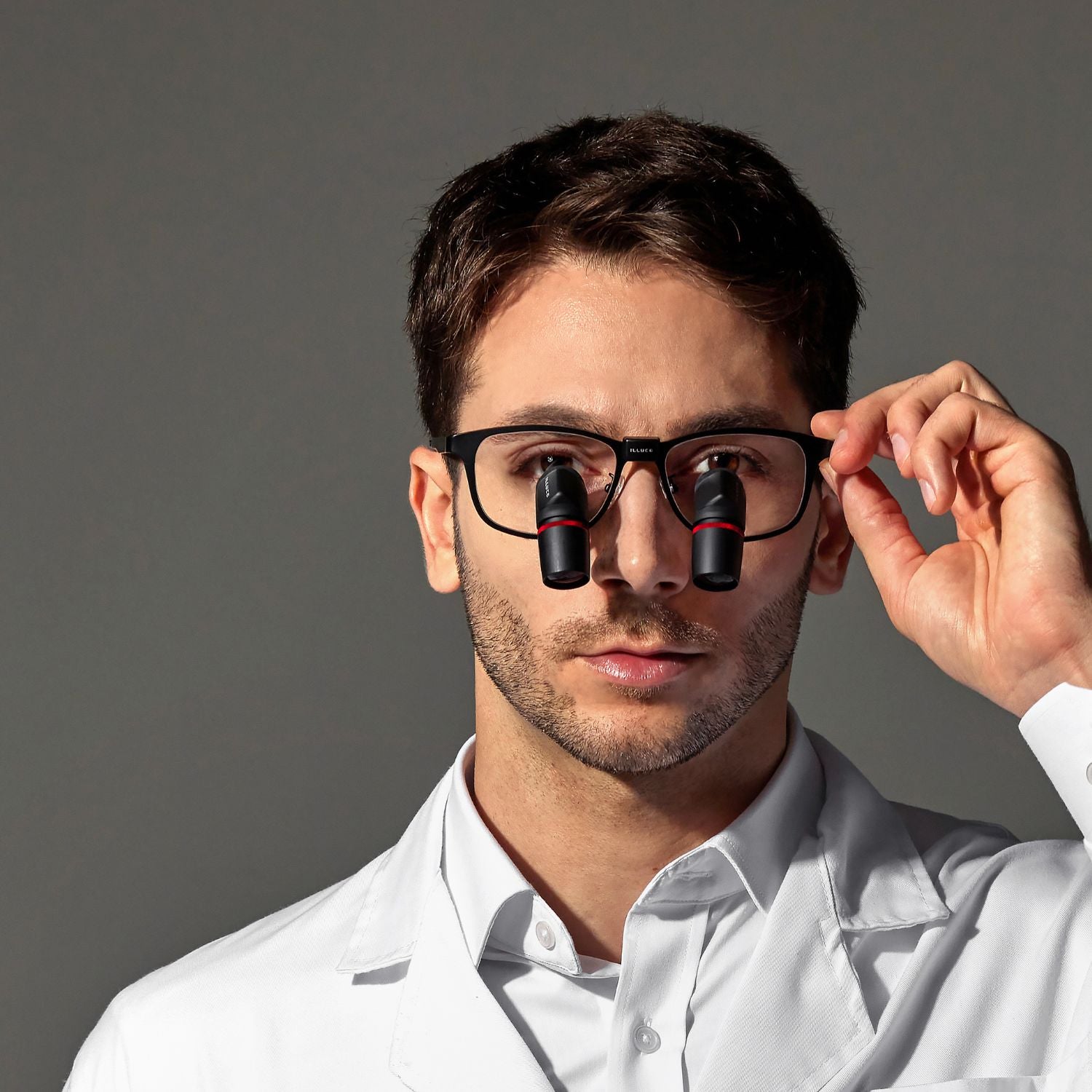 Male wearing ILLUCO angled loupes