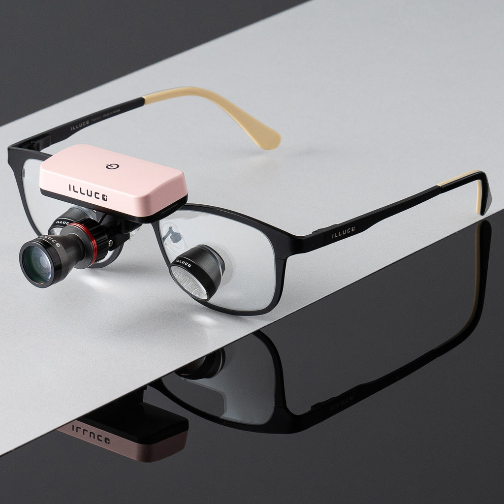Pink wireless headlight on loupes