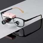 Pink wireless headlight on loupes