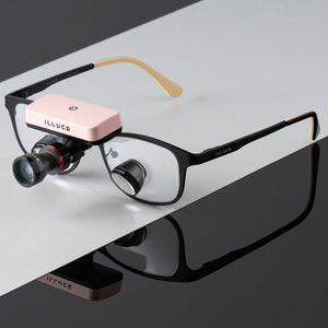 Pink wireless headlight on loupes