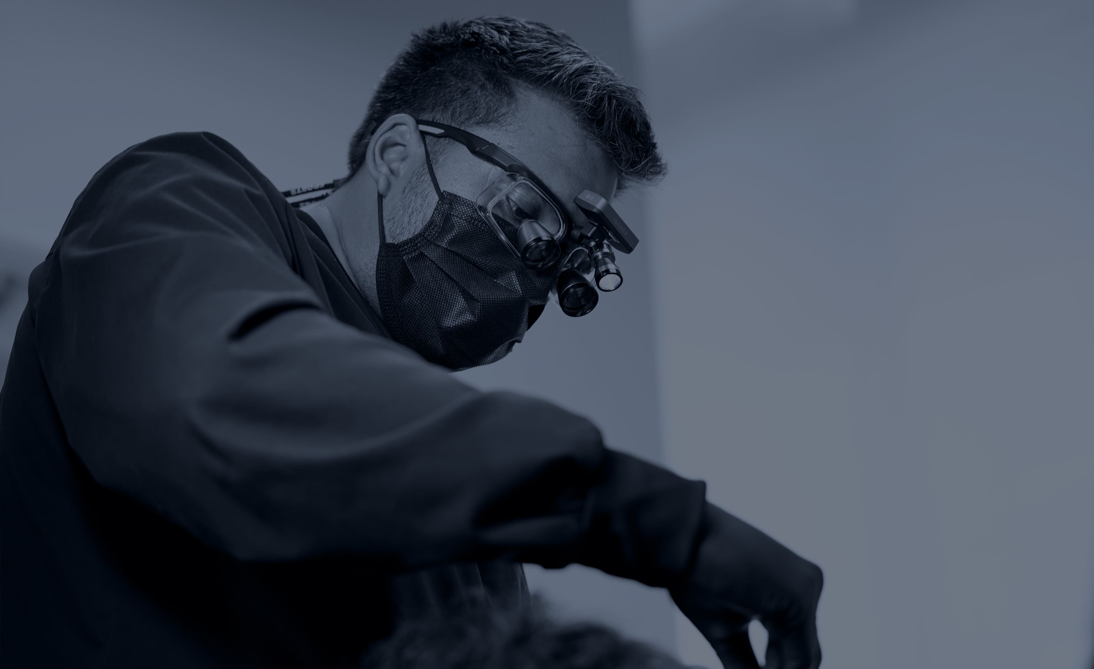 doctor wearing ILLUCO galilean 3.0x loupes