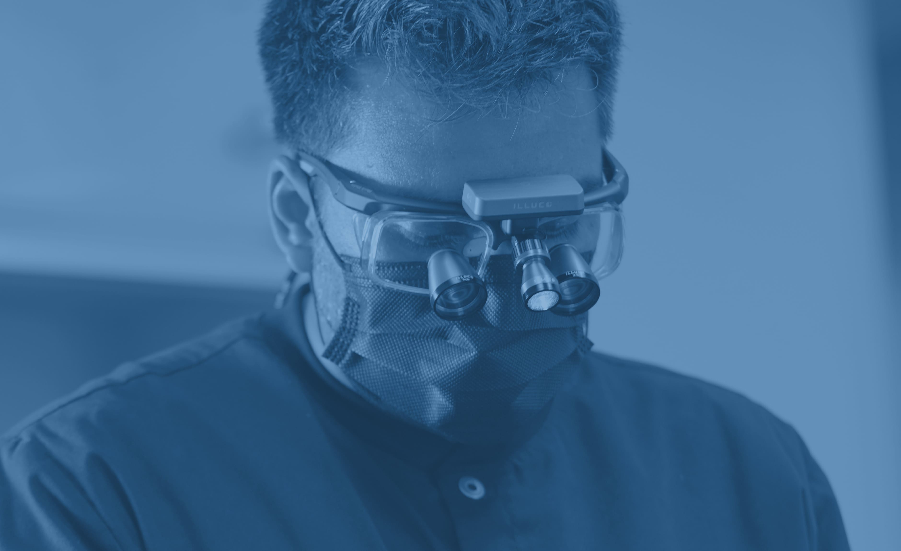 Doctor wearing 3.0x galilean ILLUCO loupes
